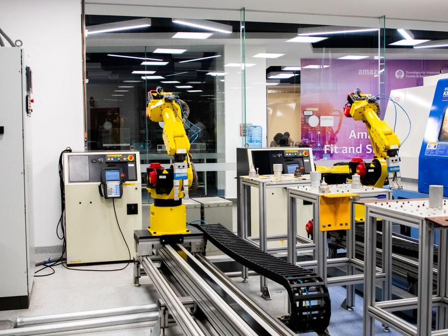 Development lab with robot arms and conveyor test rigs